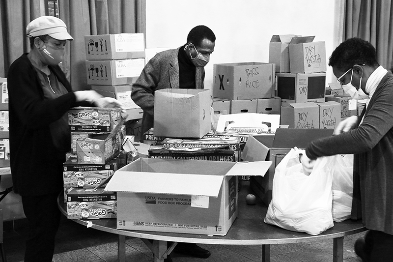 2020 : Food Lines : Seventh Day Adventists Help the Needy : Streetlife : New York City : Times Square : Richard Moore : Photographer : Photojournalist